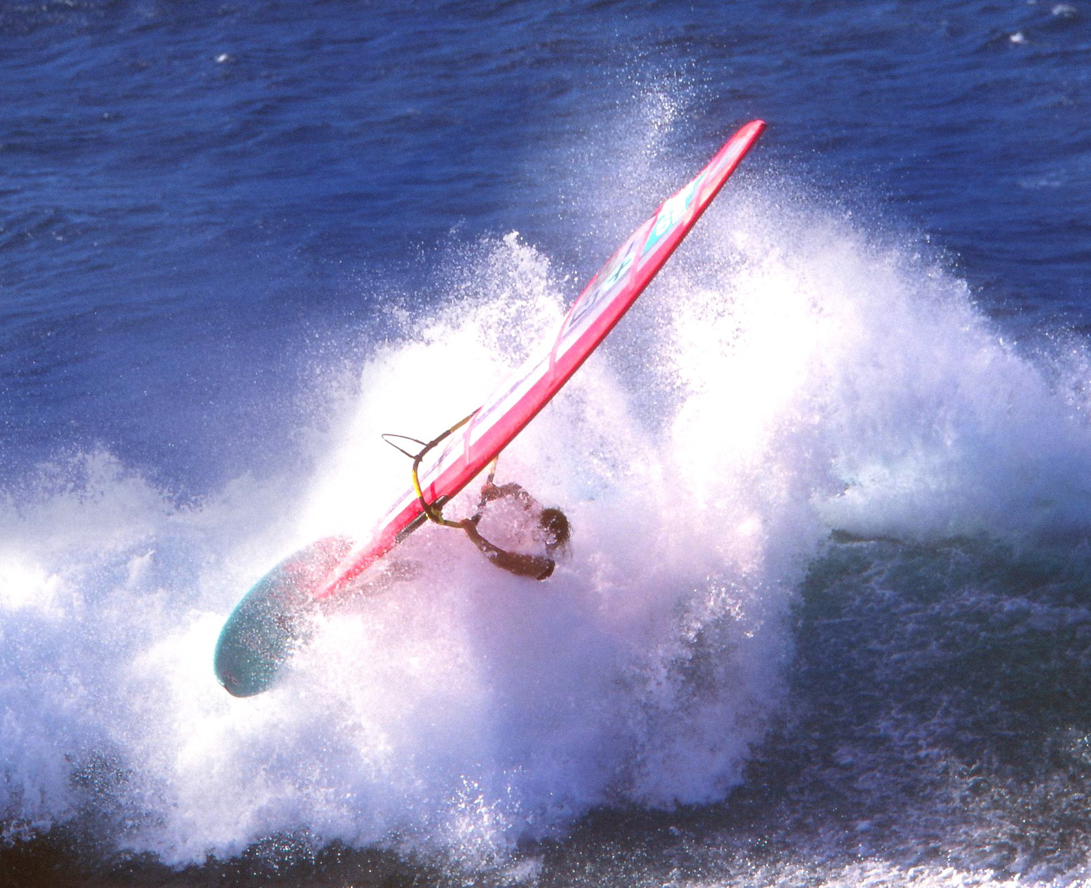 1993 archive, windsurfer carving through breaking whitewater on a pink board