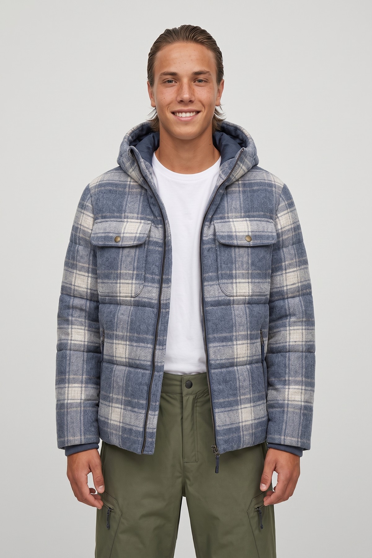 Model wearing the Plaid Wool Puffer, styled with a second collection piece