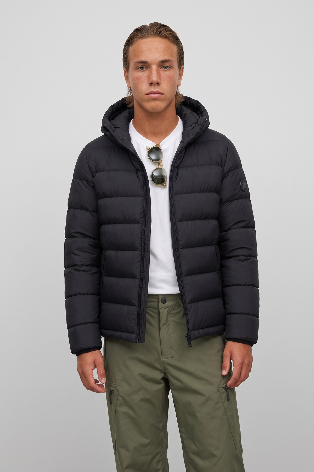 Model wearing the Alpine Down Puffer, styled with a second collection piece