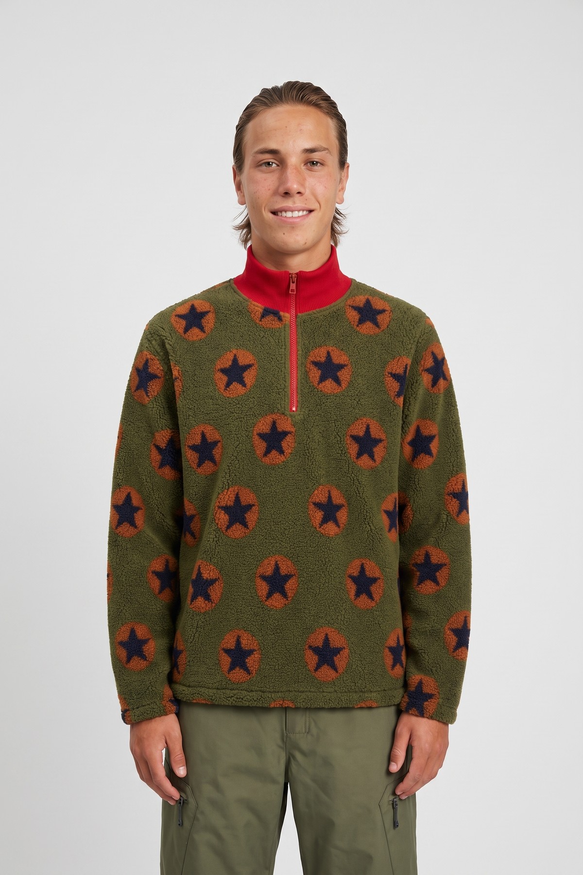 Model wearing the Star Fleece Half-Zip, styled with a second collection piece