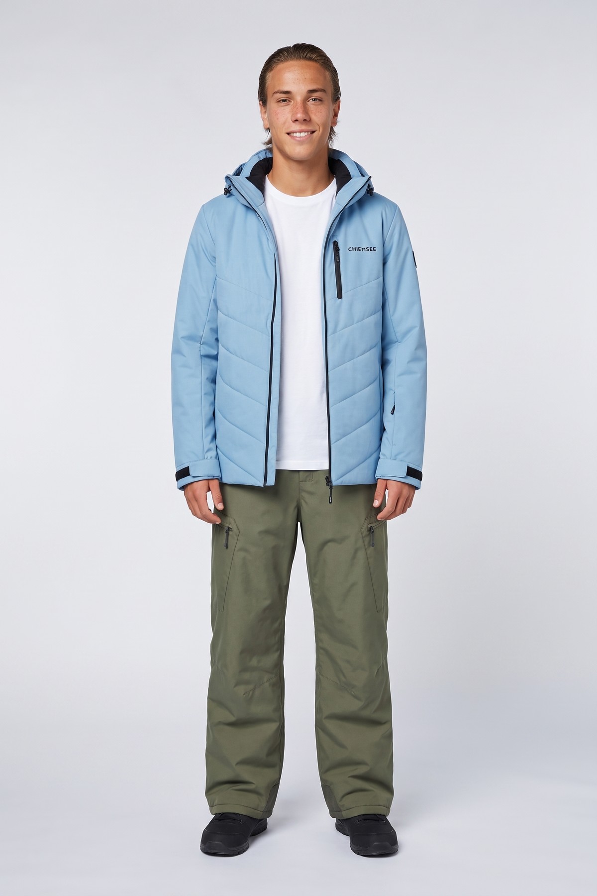 Model wearing the Chiemsee Shell Jacket, styled with a second collection piece