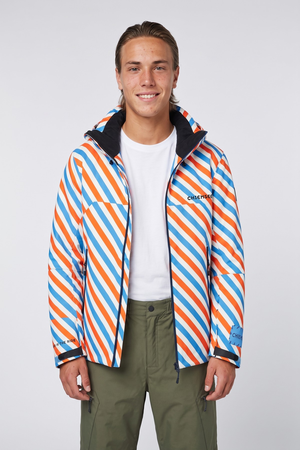 Model wearing the Diagonal Shell Jacket, styled with a second collection piece