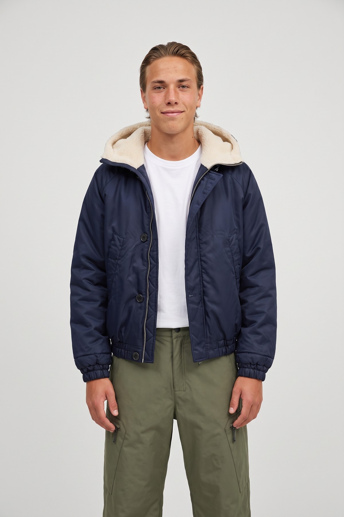 Model wearing the Padded Bomber, styled with a second collection piece